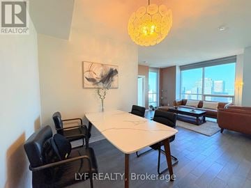 Toronto (Bay Street Corridor) condo for rent - A living room with a white table and black chairs.