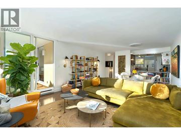 Vancouver apartment for rent - A living room with a green couch and a coffee table.