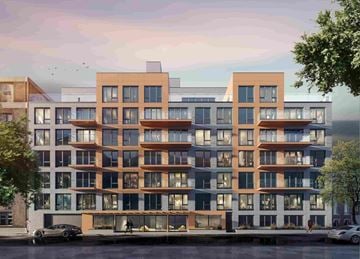 Jamaica apartment for rent - A modern apartment building with multiple balconies and a mix of brown and white exterior colors.
