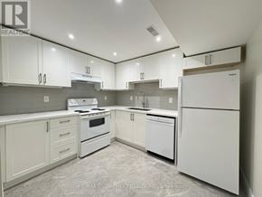 Vaughan (Maple) apartment for rent - A kitchen with white appliances and cabinets.