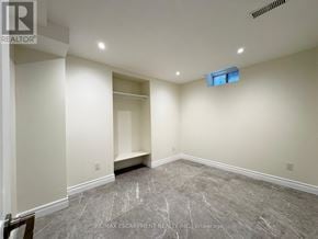 Vaughan (Maple) apartment for rent - A room with a marble floor and a window in the corner.