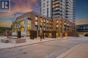 Kitchener condo for rent - A building with the number 55 on it is shown in the image.
