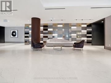Kitchener condo for rent - A modern living room with a white marble floor and a large abstract painting on the wall.