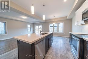Thorold (Rolling Meadows) apartment for rent - A spacious kitchen with a center island and modern appliances.