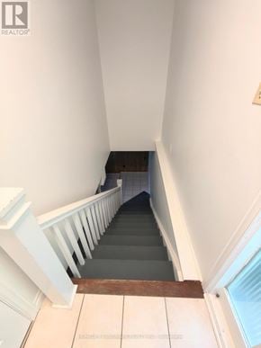 Toronto (Don Valley Village) apartment for rent - A staircase with a white railing and wooden handrail.