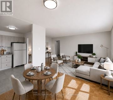Toronto (Mount Olive-Silverstone-Jamestown) condo for rent - A modern living room with a dining table set for six.