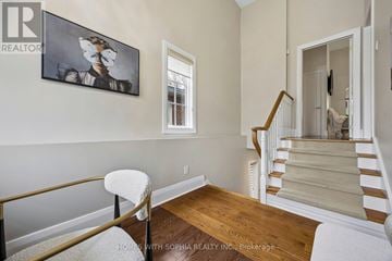 Toronto (Leaside) apartment for rent - A staircase with a white carpeted runner and wooden banister.