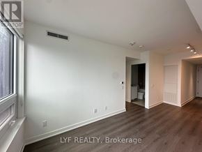 Toronto (Bay Street Corridor) condo for rent - A room with a window and a door leading to another room.