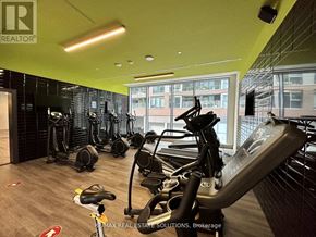 Toronto (South Riverdale) condo for rent - A gym with a variety of exercise equipment including treadmills, stationary bikes, and weight machines.