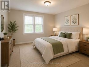 Hamilton (Huntington) multi-family for rent - A bedroom with a large bed, a nightstand, and a window.