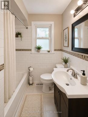 Hamilton (Huntington) multi-family for rent - A white bathroom with a toilet, sink, and window.