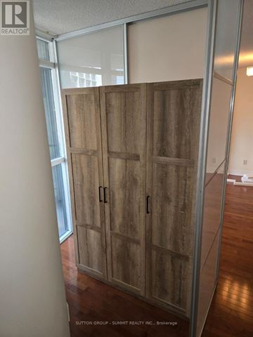 Toronto (Church-Yonge Corridor) condo for rent - A wood slat door in a room with a glass wall.