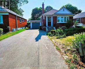 Toronto (Wexford-Maryvale) apartment for rent - A residential area with a house and a driveway.