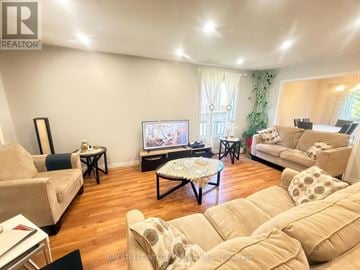 Oakville (Wm Westmount) townhouse for rent - A living room with a television and a couch.