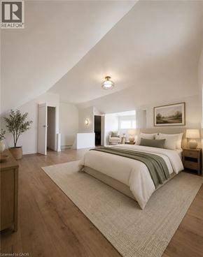 Hamilton apartment for rent - A bedroom with a large bed and a painting on the wall.