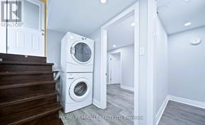 Toronto (Wexford-Maryvale) apartment for rent - A laundry room with a washer and dryer stacked on top of each other.