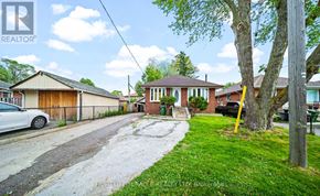 Toronto (Wexford-Maryvale) apartment for rent - A residential street with houses and a car parked on the side.