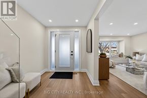 Toronto (L'amoreaux) apartment for rent - A modern living room with a glass door entrance and a black and white artwork on the wall.