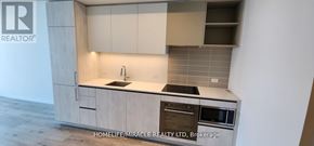 Vaughan (Vaughan Corporate Centre) condo for rent - A kitchen with a sink, stove and oven.