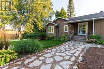 Caledon apartment for rent - A house with a stone pathway leading to the front door.