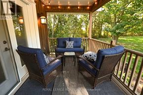 Caledon apartment for rent - A patio with a table and chairs with a view of trees.