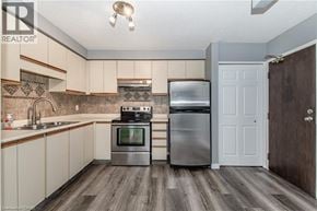 Waterloo condo for rent - A kitchen with a stove, oven, and refrigerator.