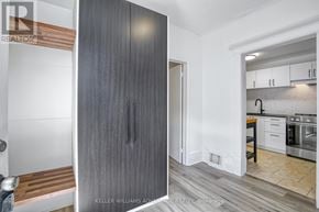 Toronto (Cabbagetown-South St. James Town) apartment for rent - A modern kitchen with a wooden floor and white walls.
