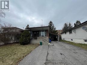 Oshawa (Donevan) apartment for rent - A house with a driveway in front of it.
