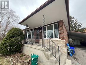 Oshawa (Donevan) apartment for rent - A house with a green trash can in front of it.