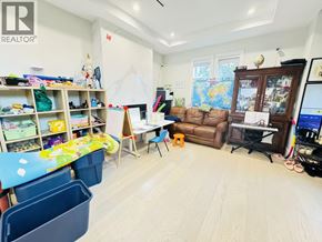 Vancouver apartment for rent - A room with a lot of toys and a map on the wall.