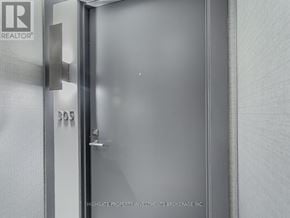 Vaughan (Concord) condo for rent - A glass door with a handle and a sign that says B05.