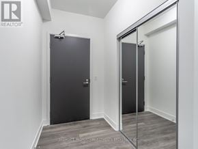 Vaughan (Concord) condo for rent - A room with two doors and a glass door.