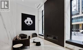 Toronto (Bay Street Corridor) condo for rent - A living room with a panda print on the wall.