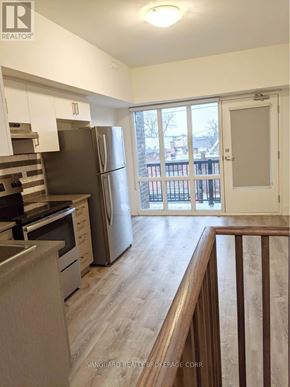 Toronto (Dovercourt-Wallace Emerson-Junction) apartment for rent - A kitchen with a refrigerator, stove, and oven.