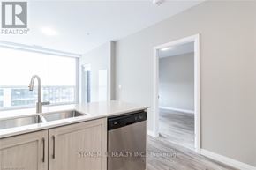 Kitchener condo for rent - A modern kitchen with a sink, dishwasher, and a window.