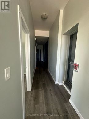 London East (East K) multi-family for rent - A hallway with wood floors and white walls.