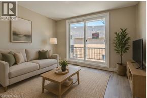 Cambridge apartment for rent - A living room with a couch, coffee table, and a window with a view of a building.