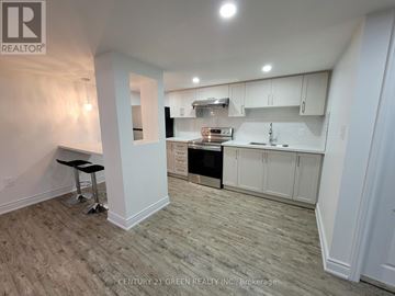 Mississauga (Churchill Meadows) apartment for rent - A white kitchen with a black stove top oven.