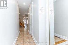 Mississauga (Meadowvale Village) apartment for rent - A hallway with a logo that says REALTOR on the wall.
