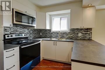 Mississauga (Creditview) apartment for rent - A kitchen with a stove top oven and microwave.