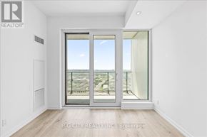Vaughan (Vaughan Corporate Centre) condo for rent - A room with a sliding glass door leading to a balcony.