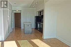 Toronto (Thorncliffe Park) condo for rent - A room with wooden flooring and a white wall.