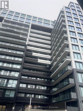 Toronto (York University Heights) condo for rent - A tall building with many windows and balconies is shown.