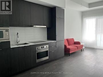 Toronto (Newtonbrook East) condo for rent - A modern kitchen with dark wood cabinets and stainless steel appliances.