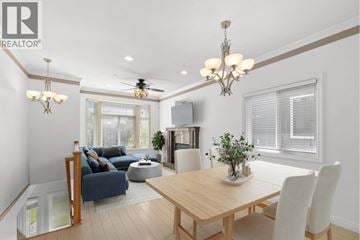 Vancouver apartment for rent - A well-lit living room with a dining table and chairs.