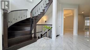 Markham (Berczy) apartment for rent - A staircase with a metal railing and wooden steps.