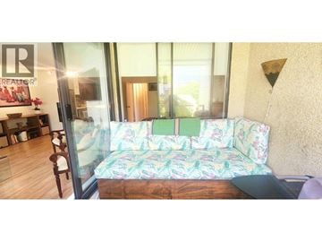 Vancouver apartment for rent - A living room with a couch and a glass door.