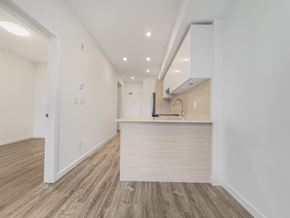 Surrey apartment for rent - A kitchen area with a counter and cabinets.