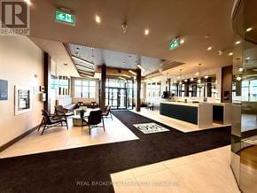 Ottawa condo for rent - A brokerage office with a black and white carpet and a green reception desk.