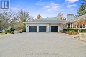 Toronto (Bridle Path-Sunnybrook-York Mills) apartment for rent - A large, empty driveway leads to a two-story house with a garage.
